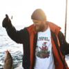 sweatshirt showing a man catching a fish