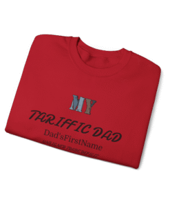 A folded red t-shirt with a text design on the front