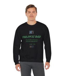 A smiling man wearing a black sweatshirt with a text design on the front