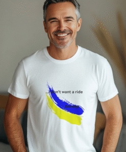 A smiling man wearing a white t-shirt with a blue and white brush stroke design on the front
